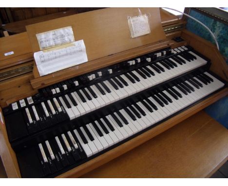 Light oak cased Hammond electric organ with associated bench stool seat and separate light oak speaker 