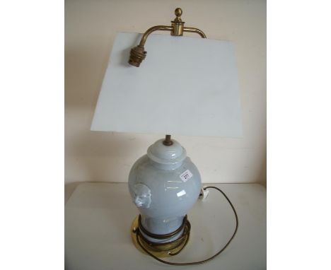 Four ceramic table lamps with twin lion mast mounts 
