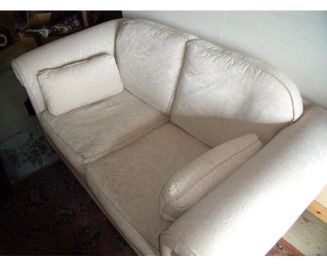 Two seat sofa in cream upholstery (width 175cm) 