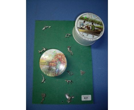 Two reproduction ceramic jars with fishing scenes to the lids and a selection of sporting pewter lapel badges 