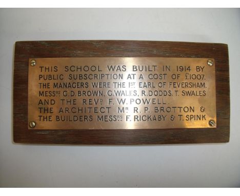 Brass plaque mounted on oak board inscribed 'The school was built in 1914 by Public Subscription at a cost of £1007.00 the ma