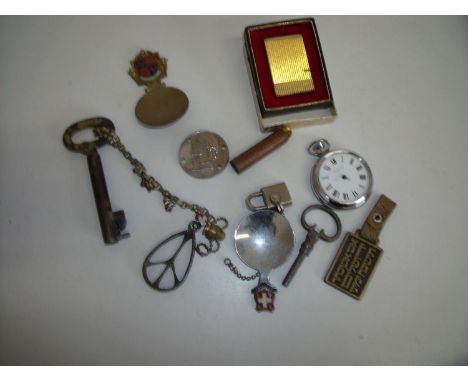 Selection of various miscellaneous items including pocket watch, souvenir spoon, old key, fobs, medallions, cigarette lighter