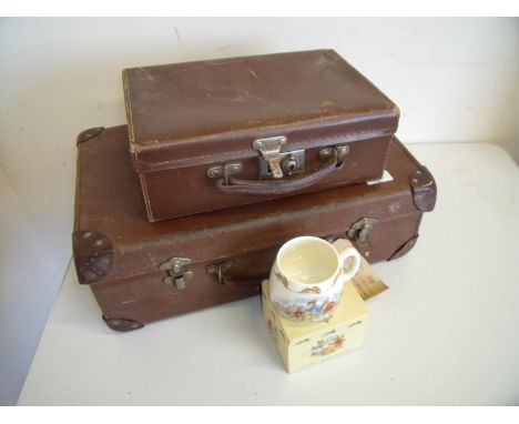 Two vintage small brown suitcases, a oak cased wall barometer and a Royal Doulton Bunnykins mug 
