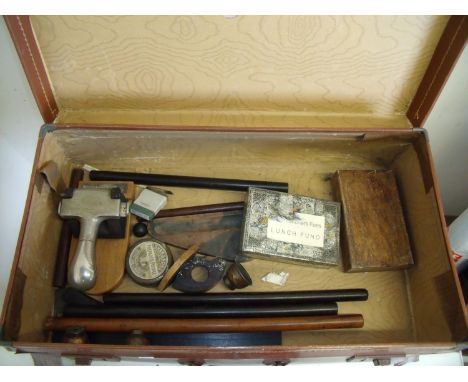 Vintage tan suitcase containing a selection of various vintage office equipment including punches, rules, ink stands etc 