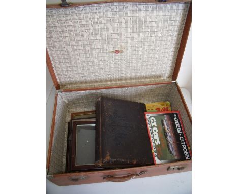 Vintage tan leather suitcase containing a Victorian photograph album (empty), various pictures, prints, booklets etc 
