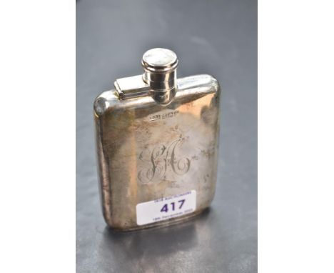 A silver hip flask of plain rectangular form bearing monogram to side and having bayonet lid, Birmingham 1917, Daniel &amp; A