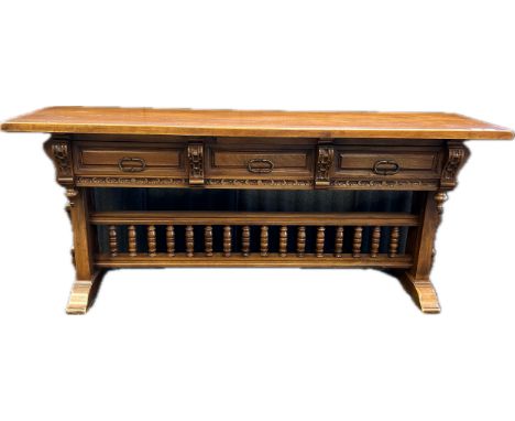 Baroque style walnut console table, the rectangular surface over three short drawers, raised on trestle legs with supporting 