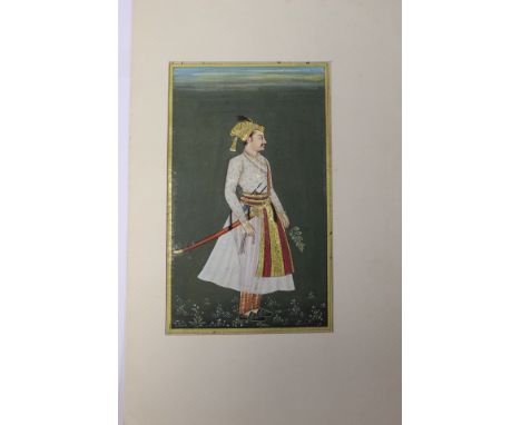 A watercolour depicting an Arab in a dress and head scarf, carrying a sword, the surround with script, possibly Urdu, 16 cms 