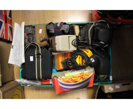 A large quantity of cameras, varying eras to include; 1920's Brownie cameras, 1950's Kodak box camera, then more later camera