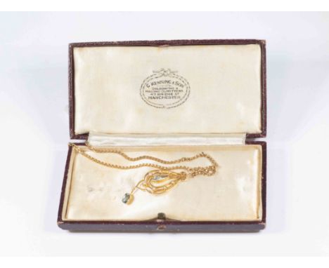 An Edwardian 15ct gold,  paste and seed pearl set pendant, the open work frame set to the centre with a blue paste drop, with