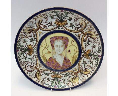 A late 19th Century Italian maiolica charger, the centre with a roundel portrait of a Medici lady, L.E monogram to the revers