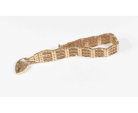 A 9ct gold fancy link gate bracelet, approx 16mm wide, with padlock clasp and safety chain, weight approx 38.4gms