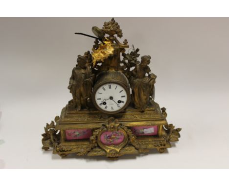 A late 19th Century gilt metal figural mantle clock, the white dial inscribed Henry Marc of Paris (A/F)