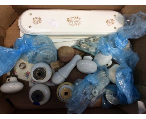 A collection of ceramic door furniture including handles, finger plates, key hole covers etc (1 box)