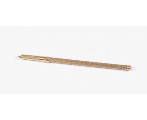 A 9ct gold  Birmingham marked propelling swizzle stick/cocktail, approx 3.9 grams, engine turned decoration 