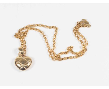 A diamond and 9ct gold heart pendant, the heart engraved with cross over lines set with three small diamonds,  approx 17mm, w
