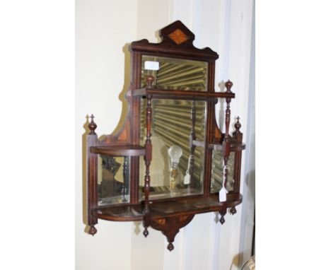 A four mirror wall shelf in mahogany inlaid with satinwood, bevelled glass