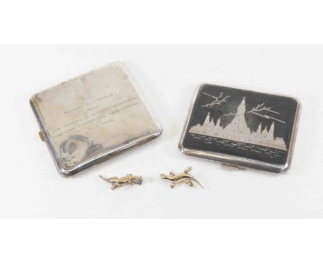 A pair of Siam sterling silver niello work cigarette cases together with two silver Lizard brooches