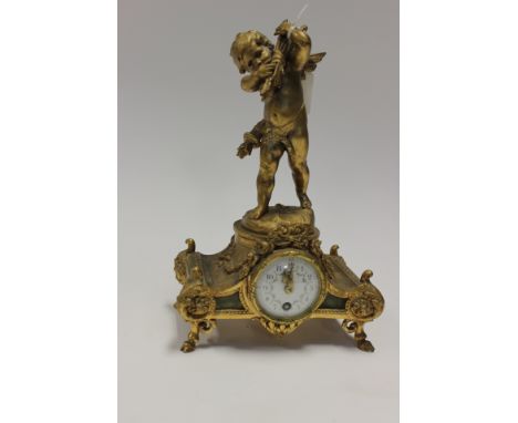 A Auguste Moreau French gilt metal mounted mantel clock, the white enamel dial painted with flowers, the shaped body with orn