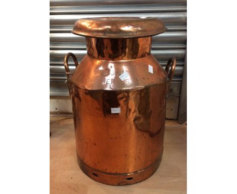 A 19th century twin handled copper mulk churn and cover, stamped 'Gate Cremeries Ltd', approx 53cm high