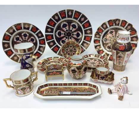 A good collection of Royal Crown Derby including a Papyrus paperweight with date letters, LI gilt button, another paperweight