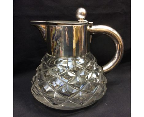 A W.M.F Silver plated and cut glass wine pitcher, with an integrated cooler to centre, hobnail cut body