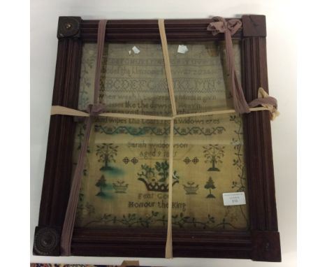 A George IV textile sampler, worked on coarse linen, floral border, worked by Sarah Widdowson, aged 9, 1825, 36cm by 31cm, fr