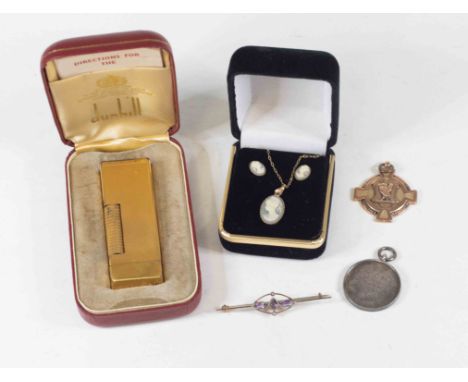 An Edwardian style gilt metal mounted amethyst and seed pearl bar brooch, together with a Dunhill lighter, a cameo necklace a