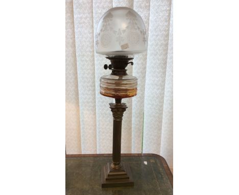 A Victorian oil lamp with shade with column stand