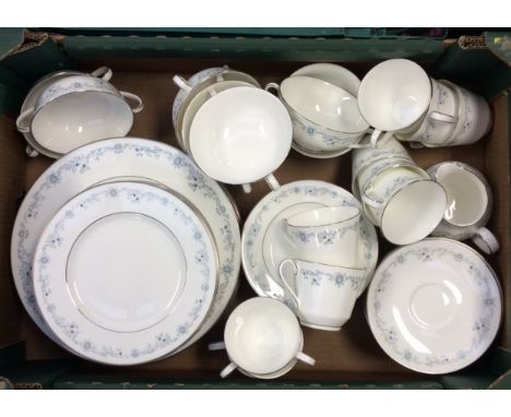 A Royal Doulton Angelique dinner service including: 10 dinner plates; 12 cheese/lunch plates; 11 teacups; 12 saucers; 12 side