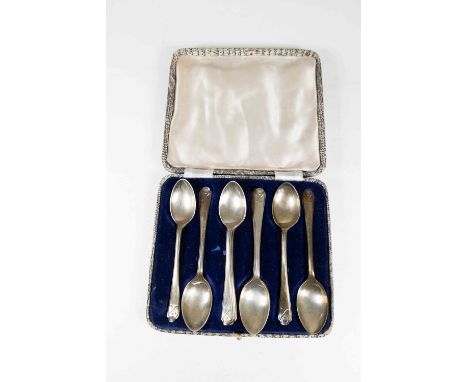 A cased set of six silver tea spoons, with two of the same design loose (embossed golf handles), Sheffield 1933, Walker &amp;