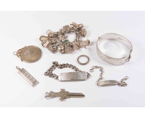 An interesting collection of silver jewellery, a key, an ingot, charm bracelet, thallia and bangle etc