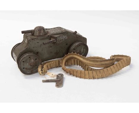A large scale Triang WWI tank, both tracks present but one split, clockwork in working order.