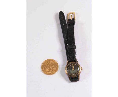 A Sovereign dated 1918, weight approx 8gms, along with a ladies gilt metal Tissot watch on black leather strap, circa 1960's,