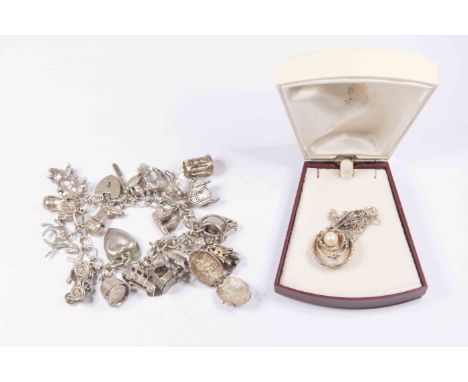 A sterling silver pendant set cultured peal stamped 925, together with a silver charm bracelet (2)