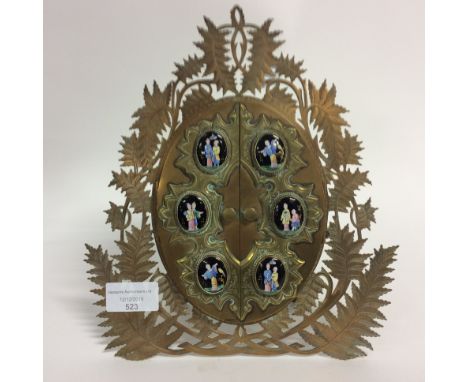 A late 19th century brass photograph frame, the hinged doors set with six enamelled cabachons opening to reveal photograph, f