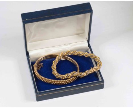 An 18ct yellow and white gold rope twist link  bracelet stamped 750, length approx 7'', total weight approx 16gms, box clasp,