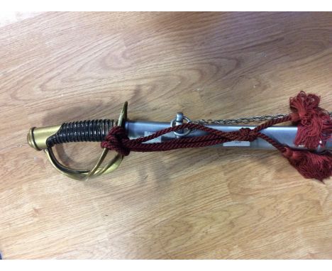US Pattern sword with brass guard. 91cm curved single edged blade marked "C&amp;J". With silver painted scabbard with two sus