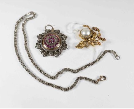 A 14 k Givenchy brooch set blister pearl, rubies and diamonds together with a ruby and rose cut diamond set pendant, the cent