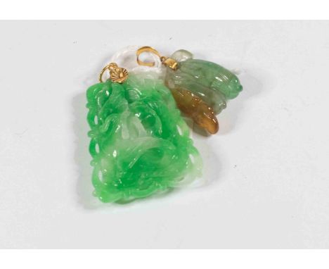 A carved dyed jade type pendant with gilt metal top along with another in the form of a butterfly (2)