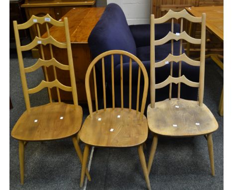 An unusual Ercol 496 Cromwellian chair, blonde, blue label, 1965-68, another stripped; an Ercol 370 Windsor Chair, blonde, bl