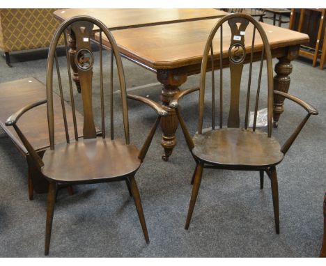 A pair of Ercol 876-A Swan back carver chairs, gold label