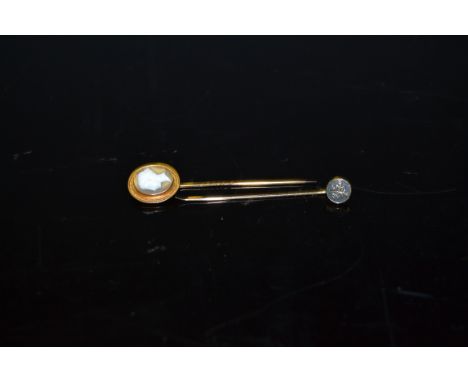 A Japanese gold stick pin, character mark; a Victorian gold coloured metal mounted cameo stick pin (2)