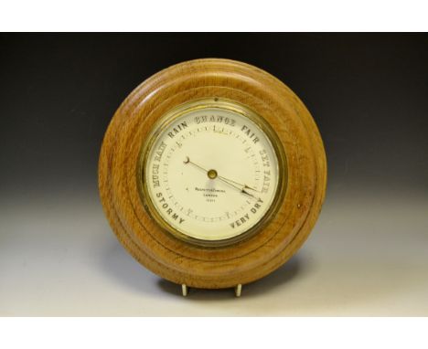 A Victorian oak aneroid barometer, by Negretti & Zambra, London, no.15571, c.1890