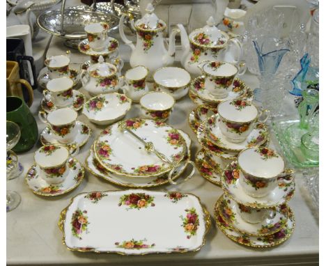 An extensive Royal Albert old country rose pattern tea and coffee service, inc teapot, coffee pot, two tier cake stand, sucri