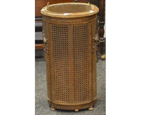 A Louis XVI bergere stick stands, carved to frieze, carved swags to flanks (later base)