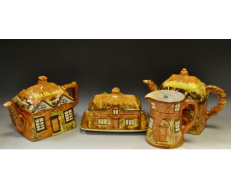 A Price Bros Cottage Ware teapot; another; butter dish; milk jug (4)