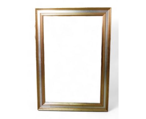 A rectangular gilt bevelled mirror, with silver coloured band to frame. 