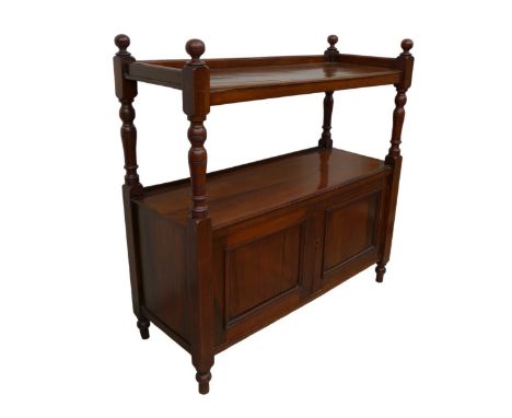 An Edwardian mahogany buffet, two shelves, twin cupboard below, raised on turned feet, 104 by 40.5 by 104.5cm high.&nbsp;Some