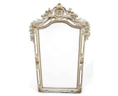 A French style gilt and cream wall mirror, with arch top, shell detail. 